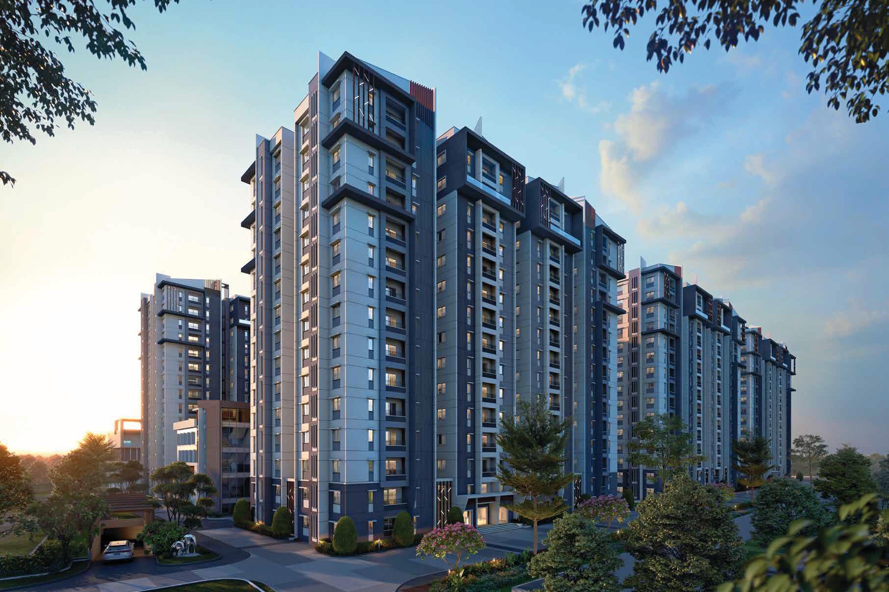 Luxury lake-view apartments with tall modern buildings reflected in a lake with green trees and blue sky